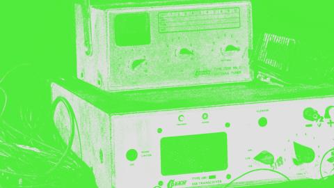 Close crop image of old AV equipment with green filter