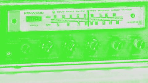 Close crop image of old radio with green filter