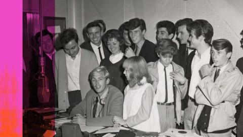 Ward Austin in the 2GB studios surrounded by musicians and singers, c1964.