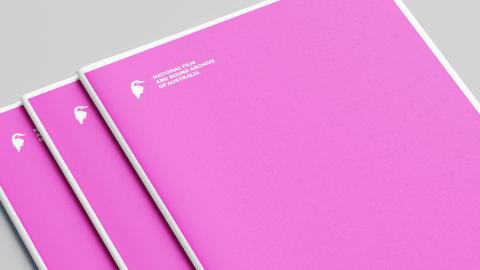 Documents featuring a white National Film and Sound Archive kookaburra logo on a pink cover