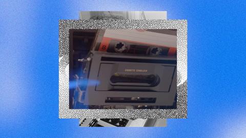 A cassette tape being inserted into a cassette player