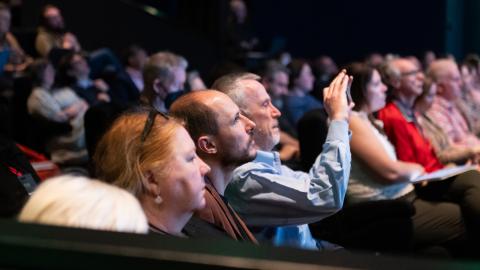 Audience watching a conference