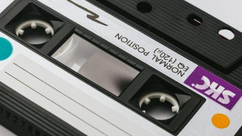 Close-up of a cassette tape with a blank label