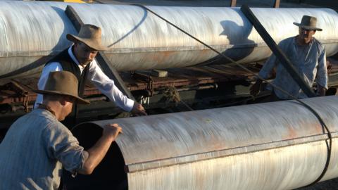 Men working on a large pipeline