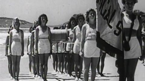 Female lifesavers from Terrigal Surf Life Saving Club participate in a march past