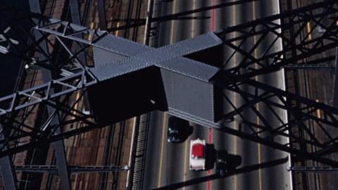 An overhead view of traffic on the Sydney Harbour Bridge in 1956