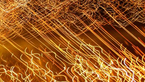 A long exposure image of lights. They have left trails across the image.