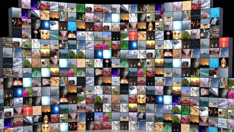 A bank of TV screens showing diverse colourful images