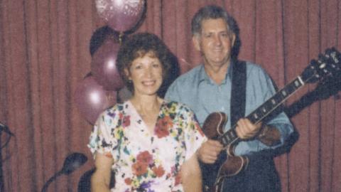 Album cover for Christmas Wishes from Lindsay and Joan. Features Joan and Lindsay posing for the camera; he is holidng a guitar.