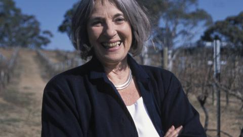 Betty Churcher standing outside, laughing