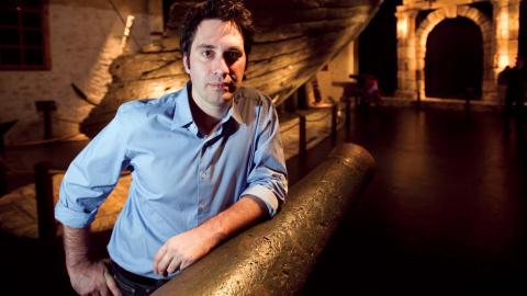 National Treasures host Chris Taylor standing near the wreck of the Batavia ship at the Western Australian Maritime Museum