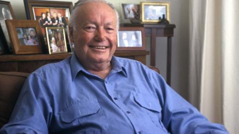 Actor Charles 'Bud' Tingwell being interviewed at home
