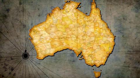 A map of Australia showing the borders of Aboriginal nations. They completely cover the map. A compass sits to the bottom left.