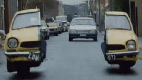 Malcolm's getaway car splits into two to avoid the police