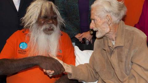 Bruce Thomas, Chair of the Wangka Maya’s Board of Directors (left), shakes hands with John Hutchinson (right)