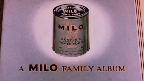 Still showing a milo tin with 'A Milo Family Album' underneath