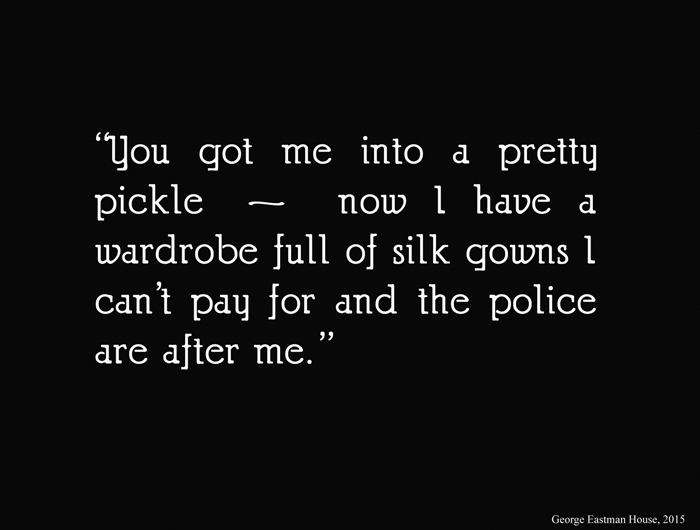 Drifting intertitle Intertitle from 'Drifting', 1923, white text on black screen and it reads "You got me into a pretty pickle - now I have a wardrobe full of silk gowns I can't pay for and the police are after me."