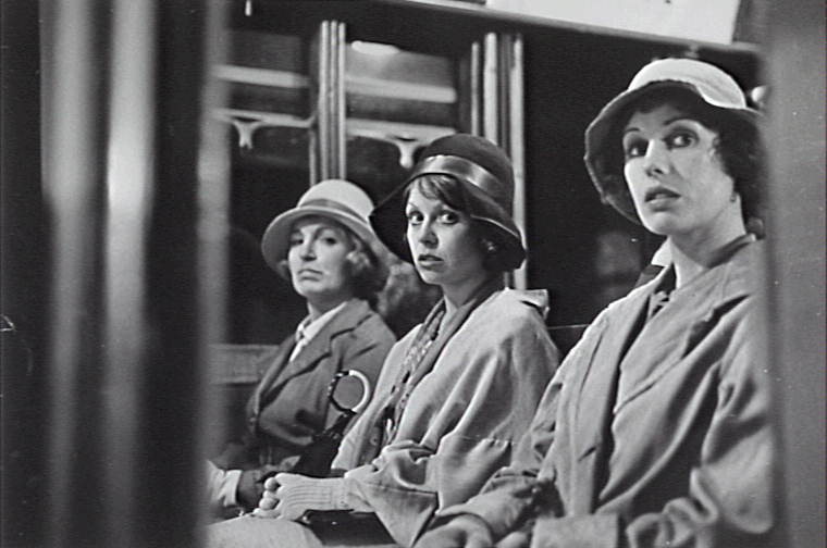 Film still from Caddie with Jacki Weaver as Josie and Helen Morse as Caddie traveling on a train with another person.