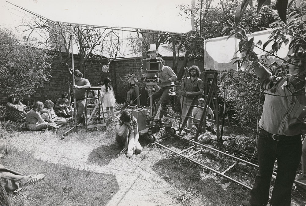 Caddie film crew setting up in a Sydney backyard.