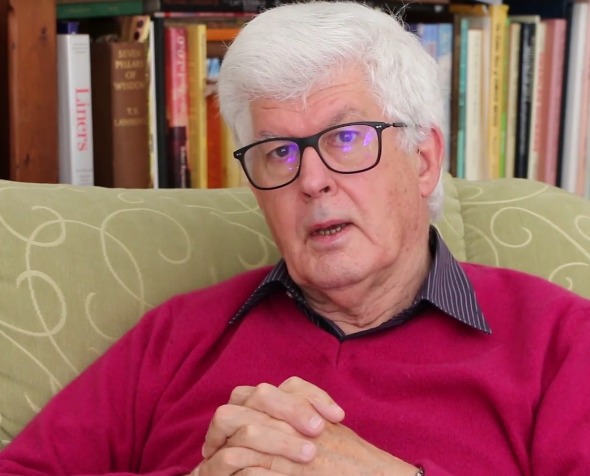 Anthony Buckley seated at home with his hands clasped being interviewed.
