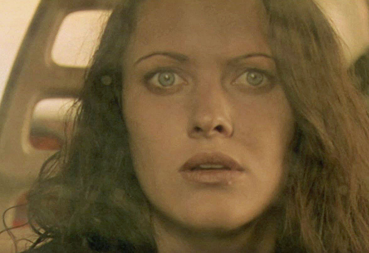 Big close up of a woman looking scared